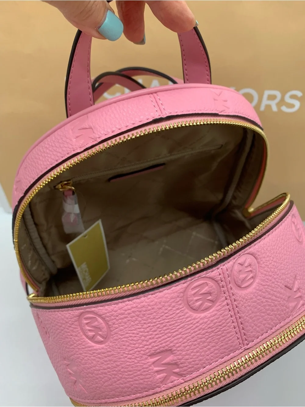 Michael Kors Rhea Carnation color Embossed MK Logo Backpack with Gold Hardware